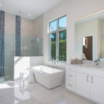 Master bathroom view of sink, freestanding tub and oversized walk-in shower in the Joanne house plan