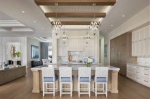 View of the double island kitchen in a 9244sf luxury house plan