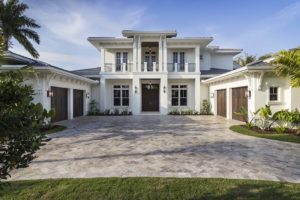 Front elevation image of a 2-story luxury coastal contemporary house plan