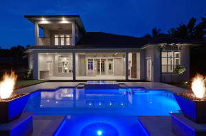 2-story 4 bedroom contemporary great room house plan features kitchen with 2 islands, laundry room upstairs, laundry room downstairs and covered lanai with outdoor kitchen designed by South Florida Design, Naples, FL